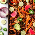 Sheet Pan Chicken Fajitas with lime wedges and jalapeño no slices