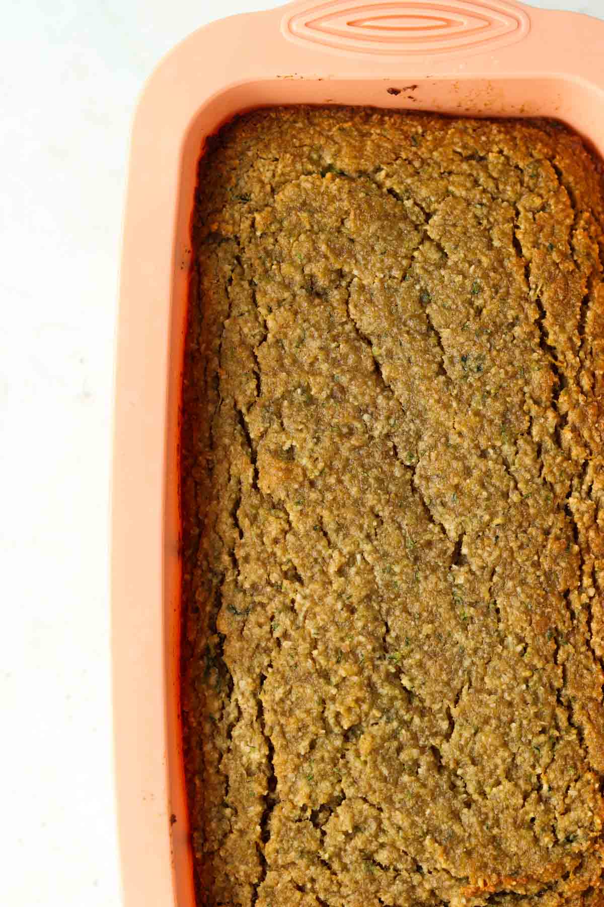 Zucchini bread in a silicone loaf pan.