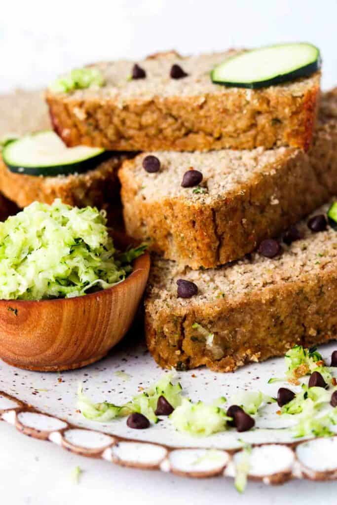 Stacked up zucchini bread on a plate.