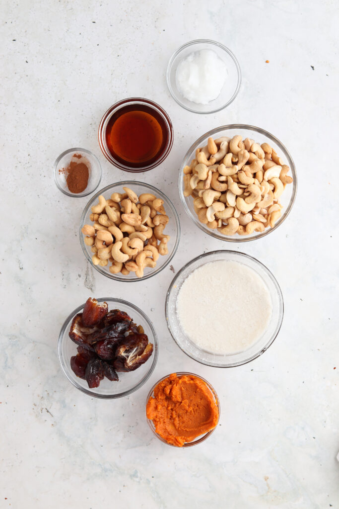 paleo pumpkin cheesecake ingredients in small bowls