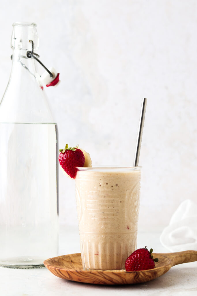 strawberry banana mango smoothie in a glass