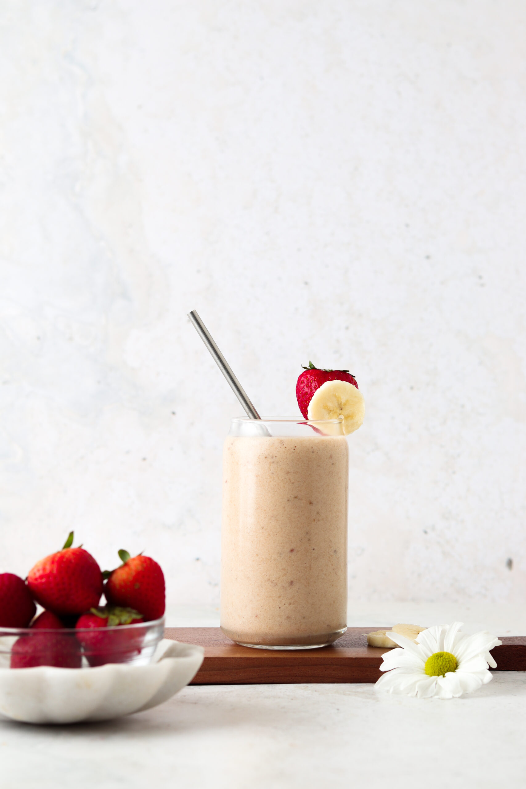 Far away shot of a strawberry smoothie with bananas.