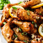 side shot of honey lemon pepper wings in a bowl