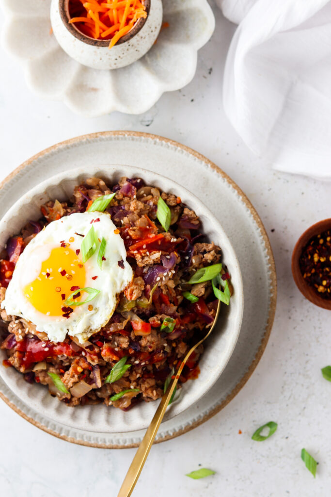 paleo egg roll in a bowl with an egg on top