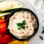 whole30 hummus in a bowl with vegetables