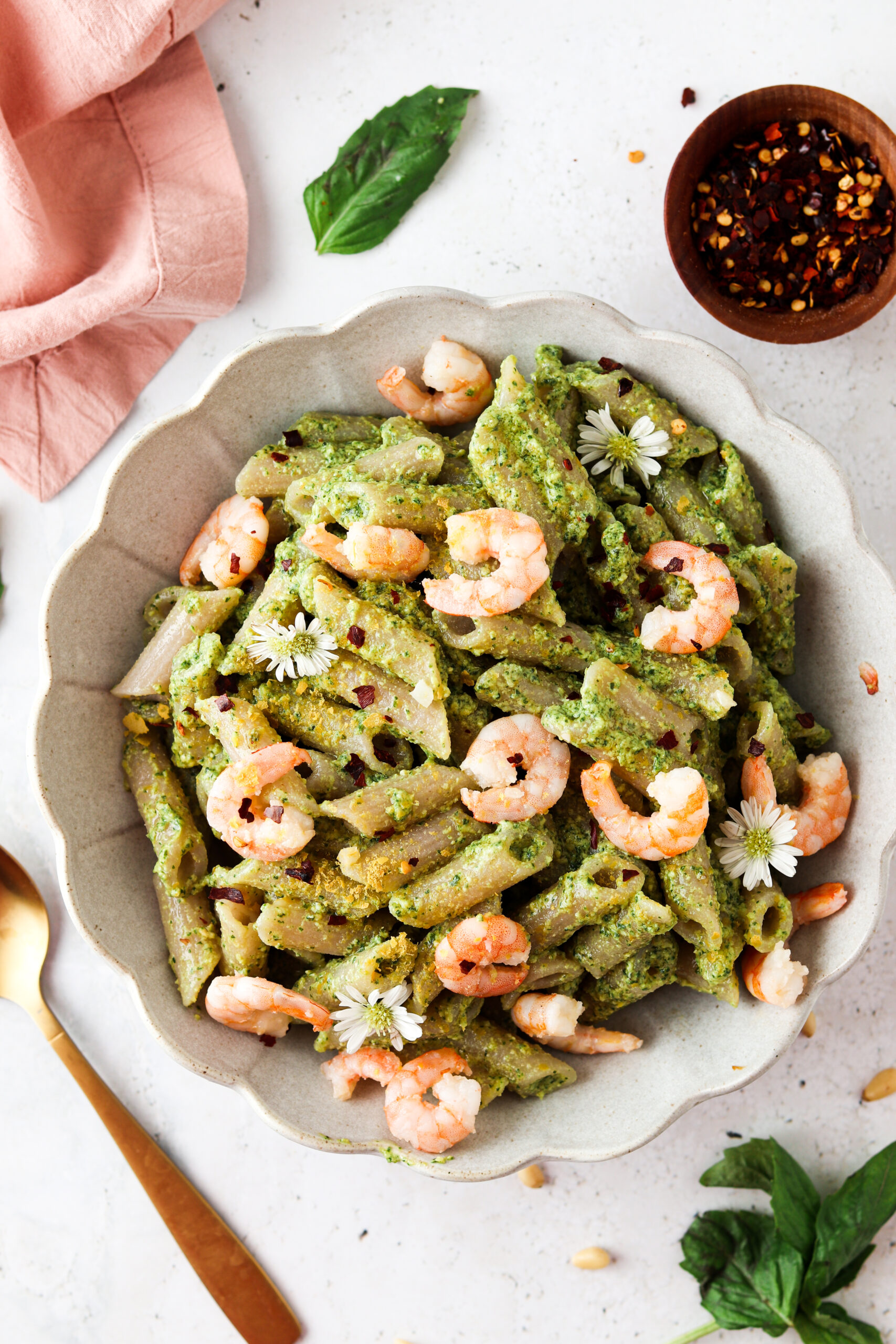 Whole30 pesto sauce over pasta and topped with shrimp.