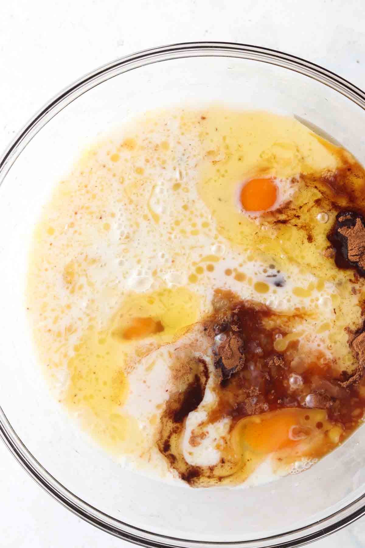 All french toast wet ingredients in a large glass bowl.