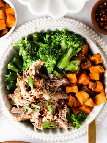 pork butt in a bowl with sweet potatoes and broccoli