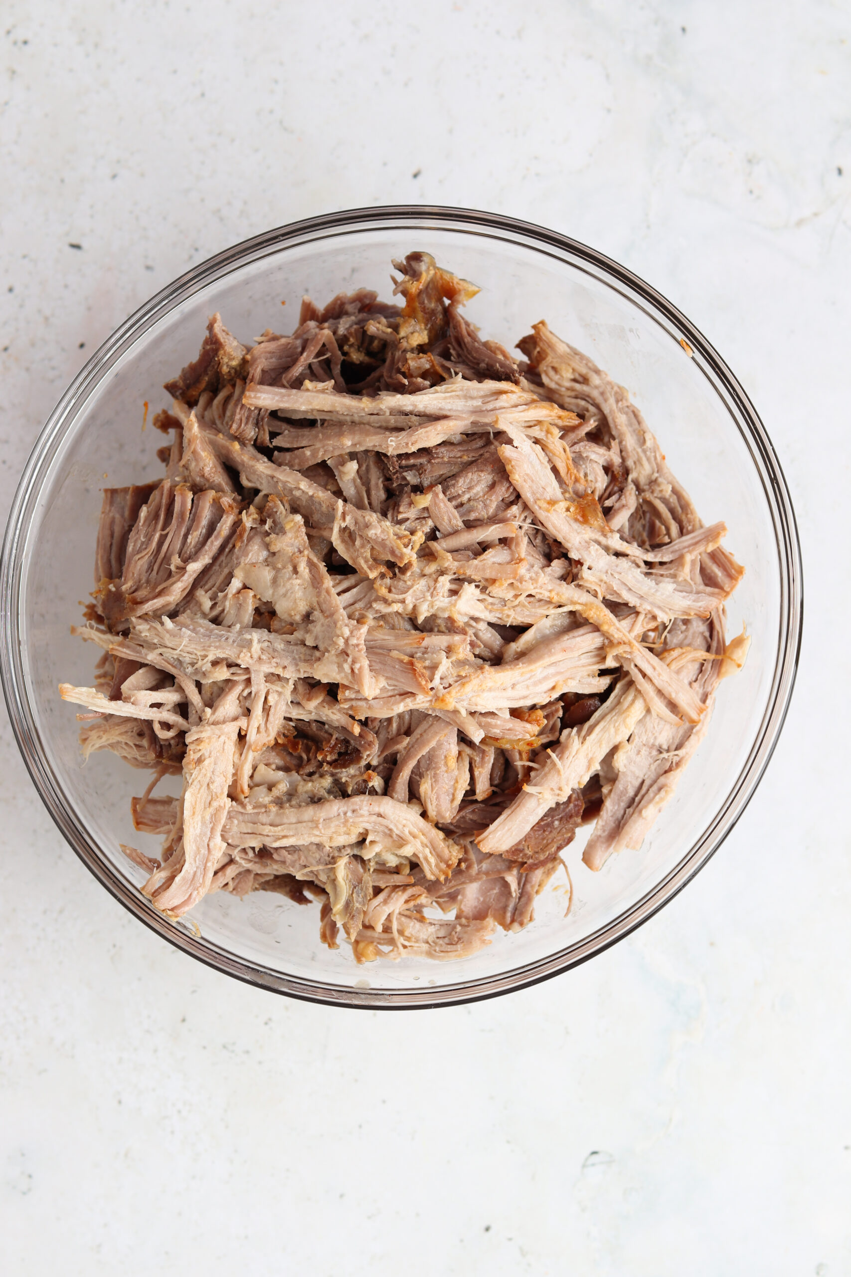 Shredded pork pot in a glass bowl. 