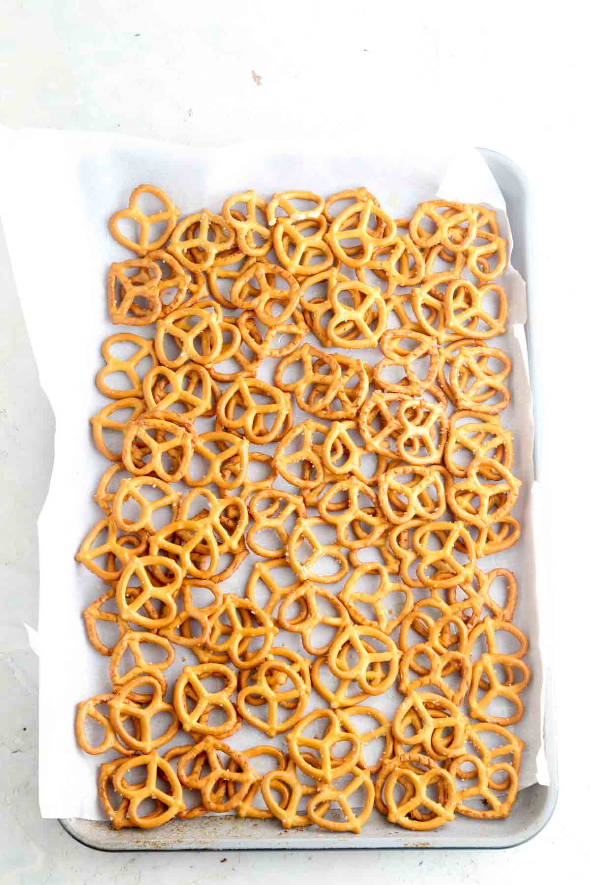 Pretzels laid out on a sheet pan.