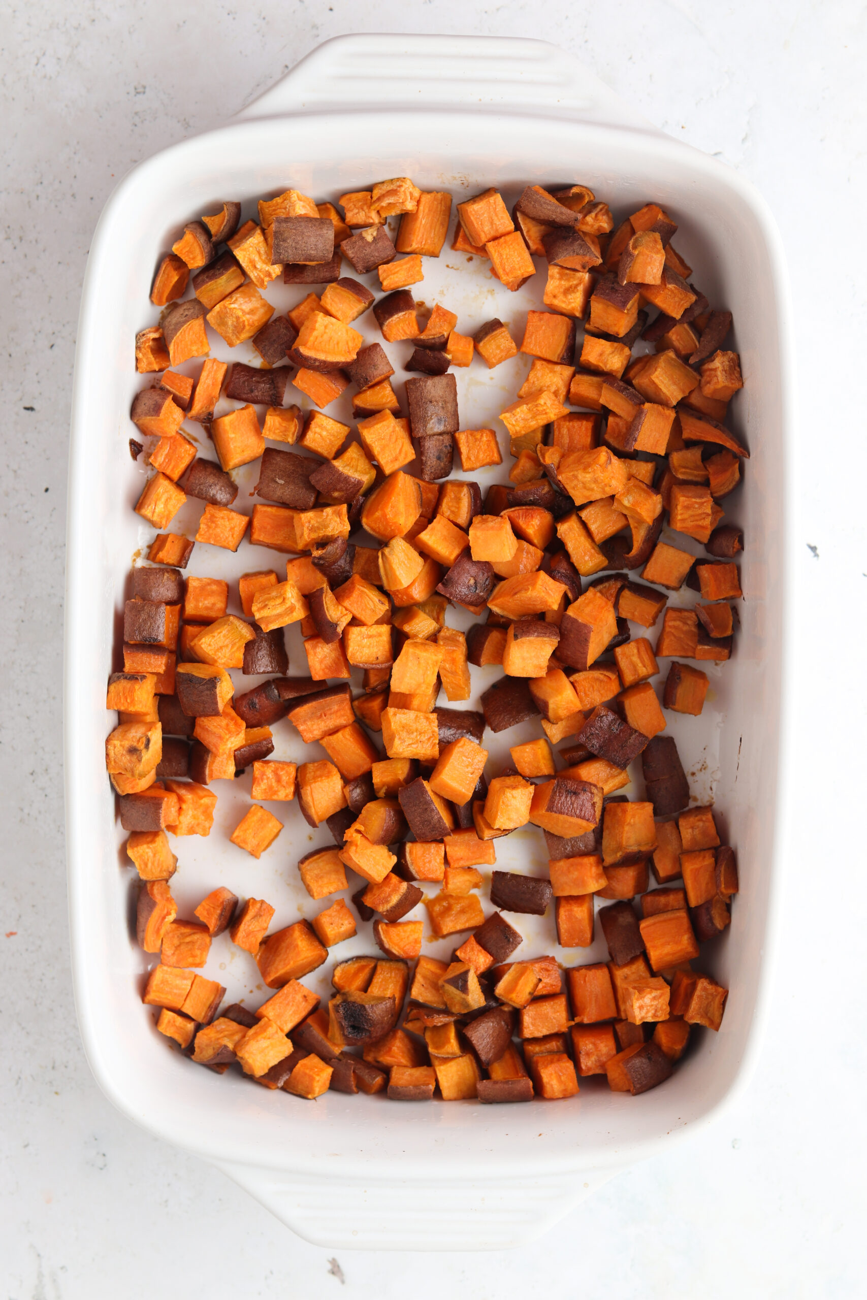 Sweet potatoes in a baking dish.