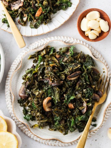 kale and mushrooms on a pretty plate