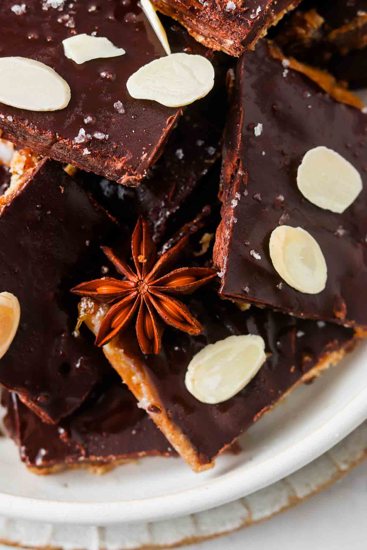 gluten free christmas crack on a plate with almond slivers