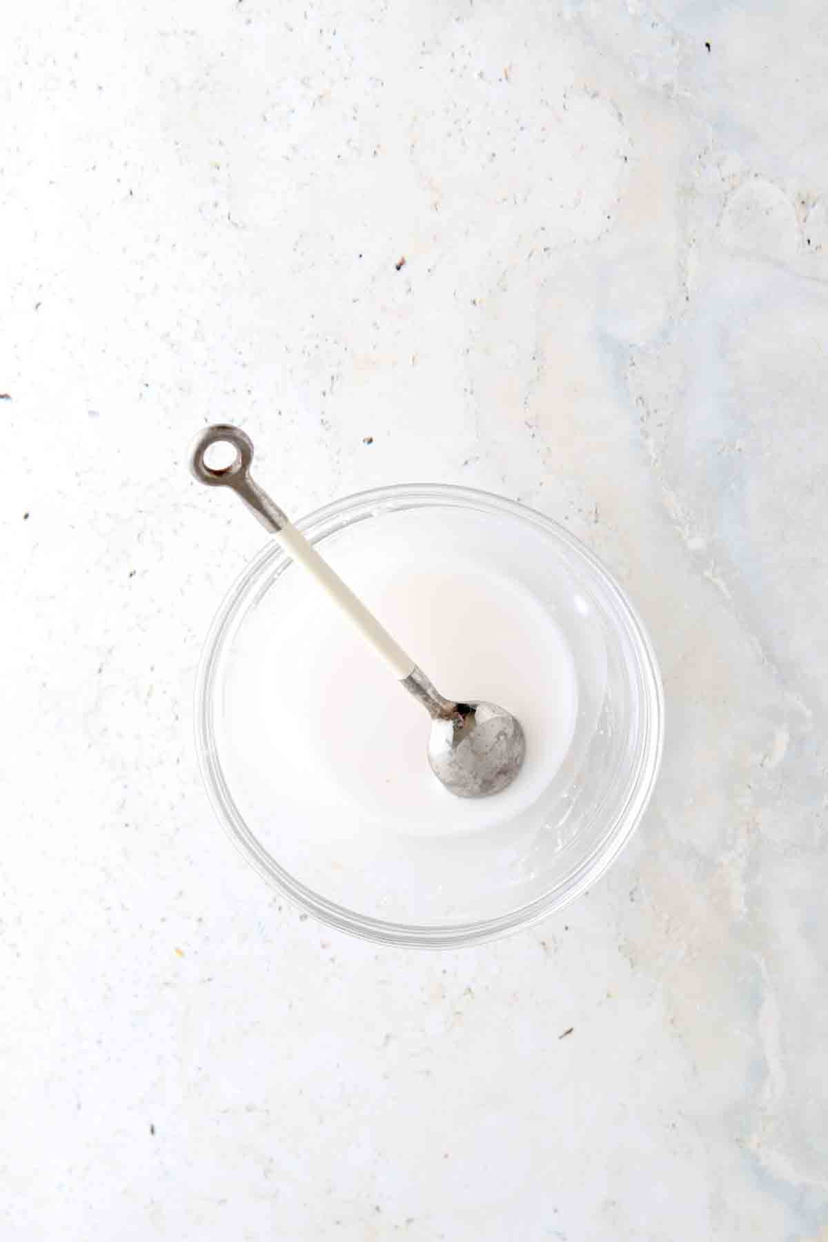 Arrowroot and water mixed in a bowl.