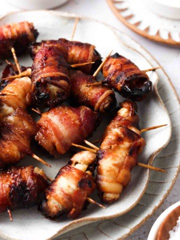 bacon wrapped dates on a place