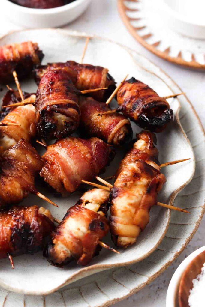 bacon wrapped dates on a place