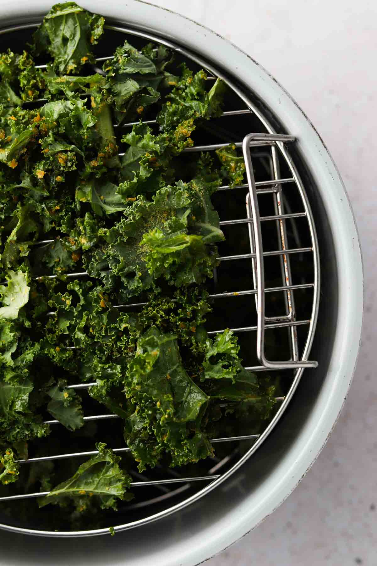 Kale on a dehydrator rack.