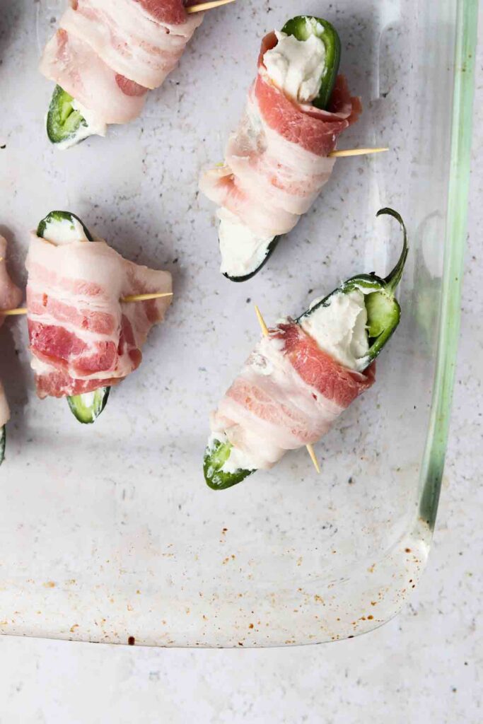 jalapenos stuffed with cream cheese wrapped in bacon