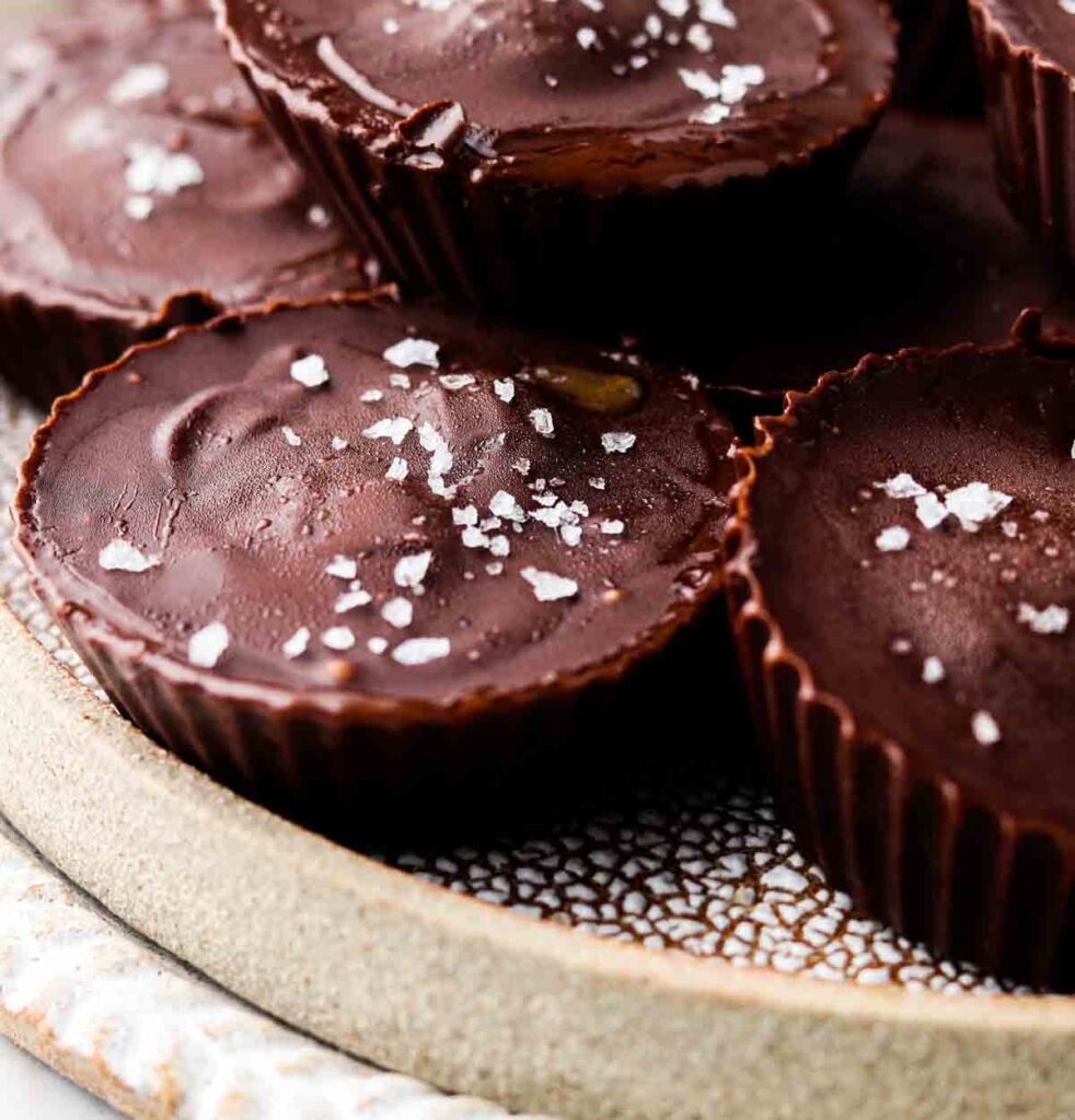 dairy free peanut butter cups stacked on a plate