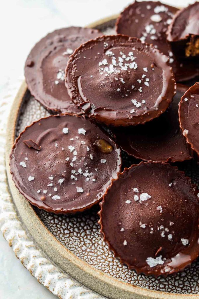 far away shot of dairy free peanut butter cups on a plate