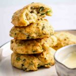 4 aip paleo bread rolls stacked on a plate