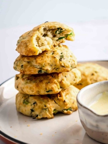 4 aip paleo bread rolls stacked on a plate