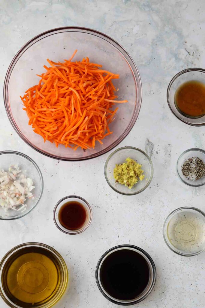 carrot ginger dressing ingredients laid out in bowls