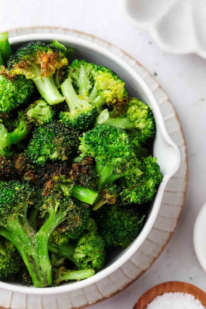 frozen broccoli in a bowl with sea salt on the side