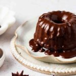 mini gluten free bundt cakes on a plate with chocolate ganache