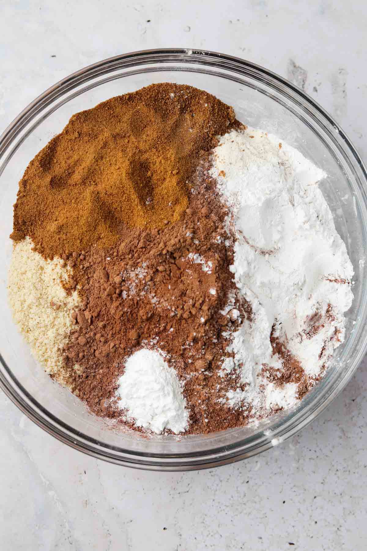 Chocolate cake dry ingredients in a glass bowl.