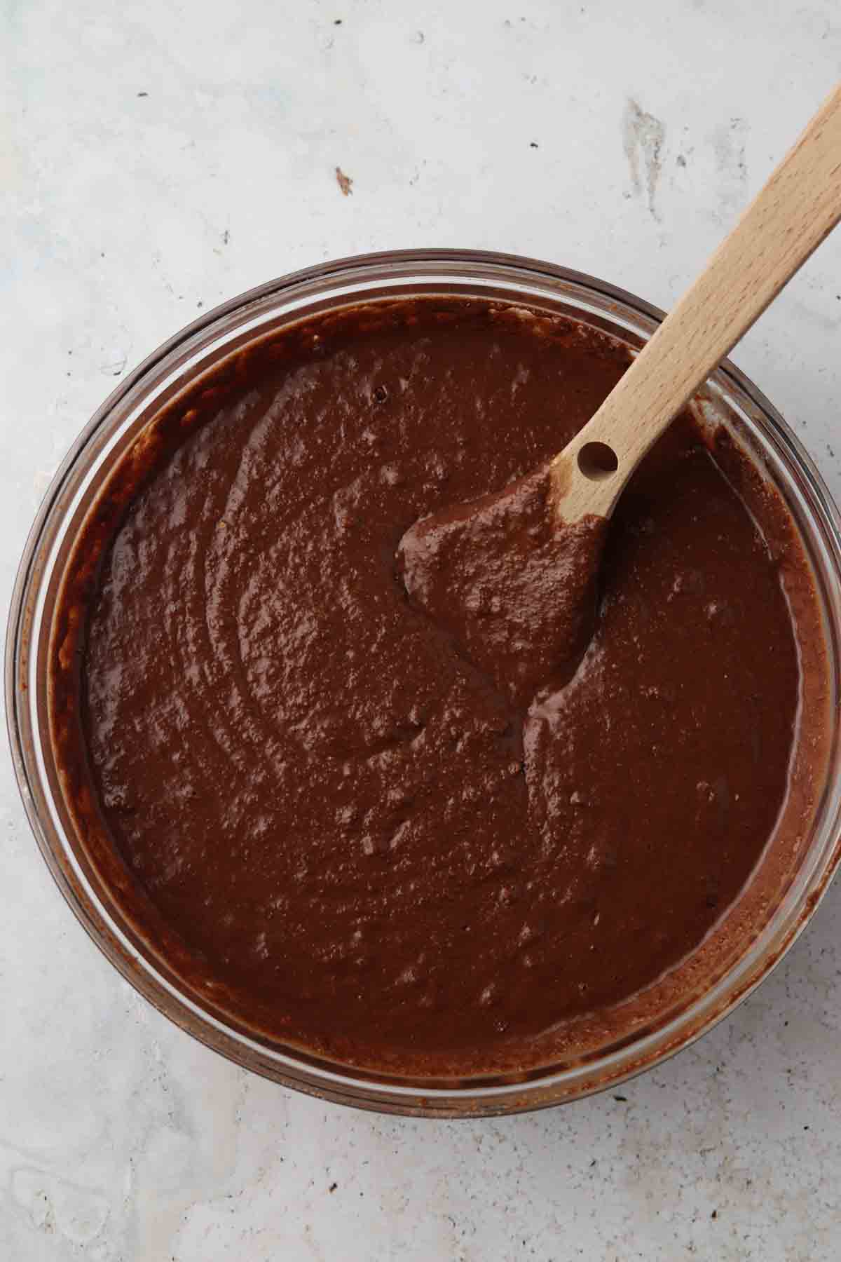 Wet chocolate cake ingredients mixed with dry chocolate cake ingredients. 