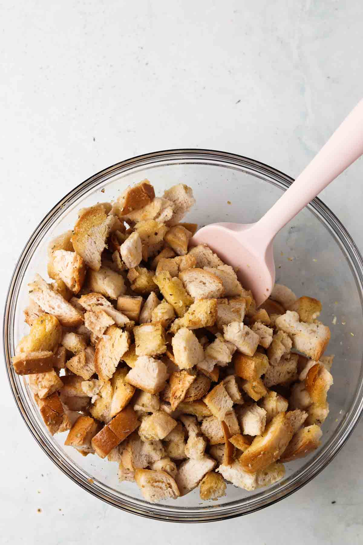 Gluten free croutons ingredients in a glass bowl.