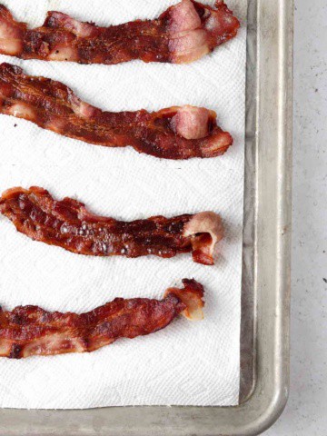 bacon cooling on a paper towel