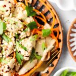 paleo pad thai on a plate with peanuts on top