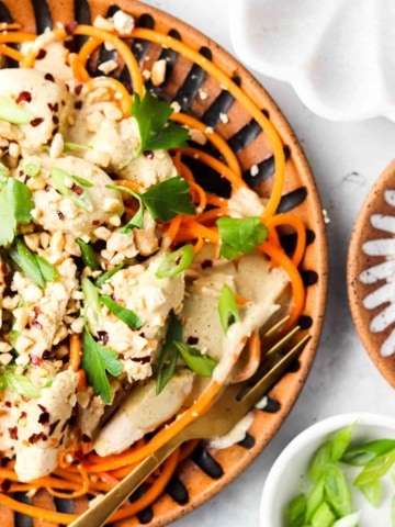 paleo pad thai on a plate with peanuts on top