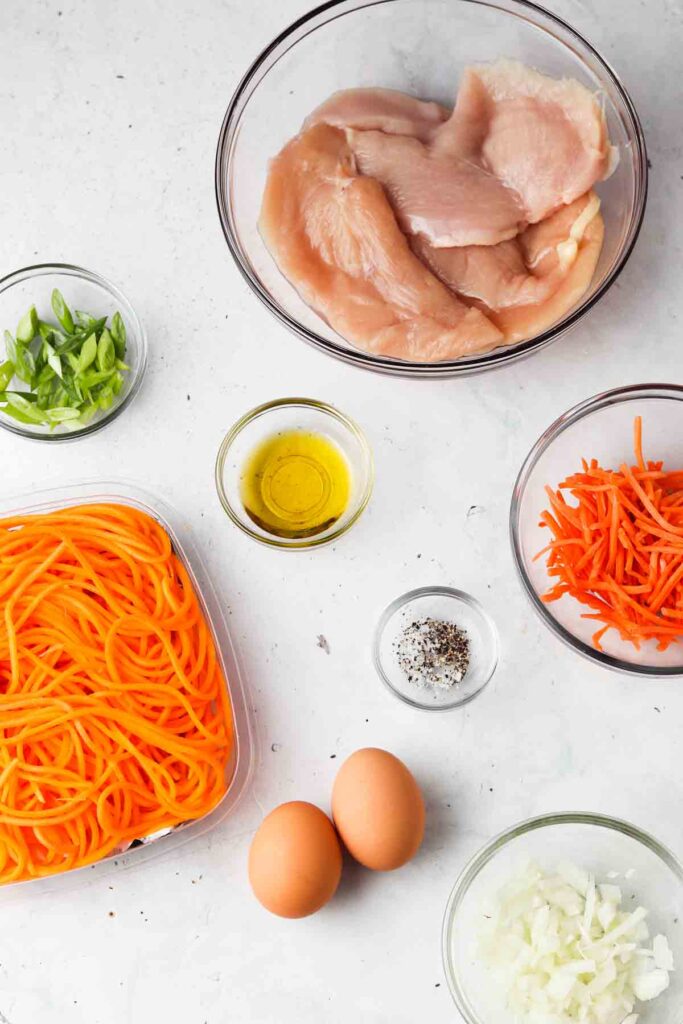 chicken pad thai ingredients laid out in bowls