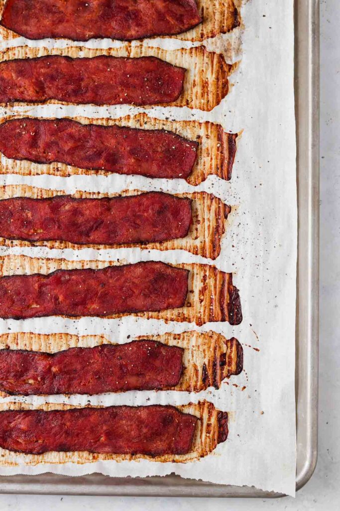 cooked turkey bacon on a baking sheet