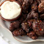 steak bites on a plate with garlic aioli