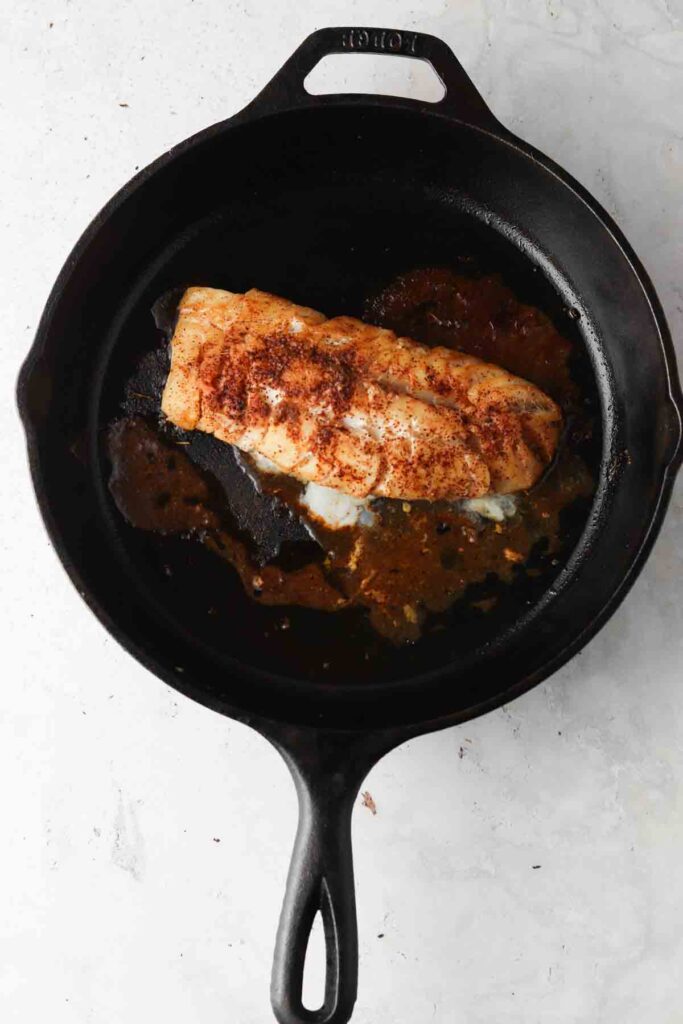 pan seared cod in a cast iron skillet