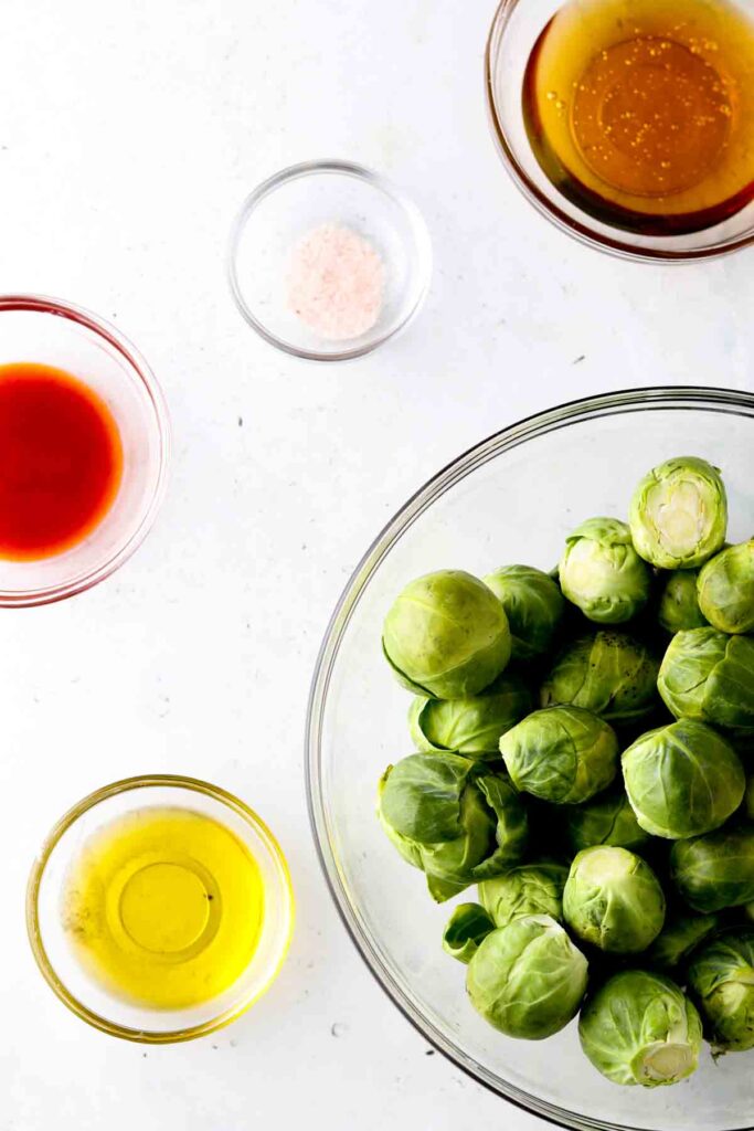 brussel sprouts, honey, sriracha, garlic and olive oil in bowls
