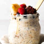 oats with protein in them in a jar with berries on top