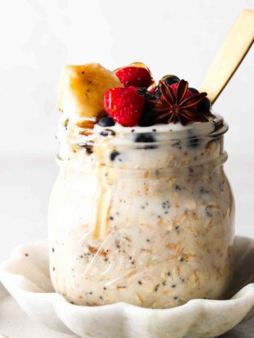 oats with protein in them in a jar with berries on top