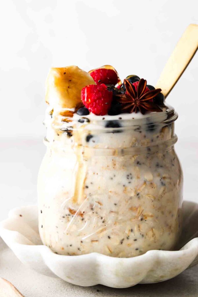 oats with protein in them in a jar with berries on top