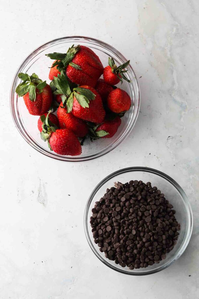 vegan chocolate covered strawberry ingredients laid out in bowls