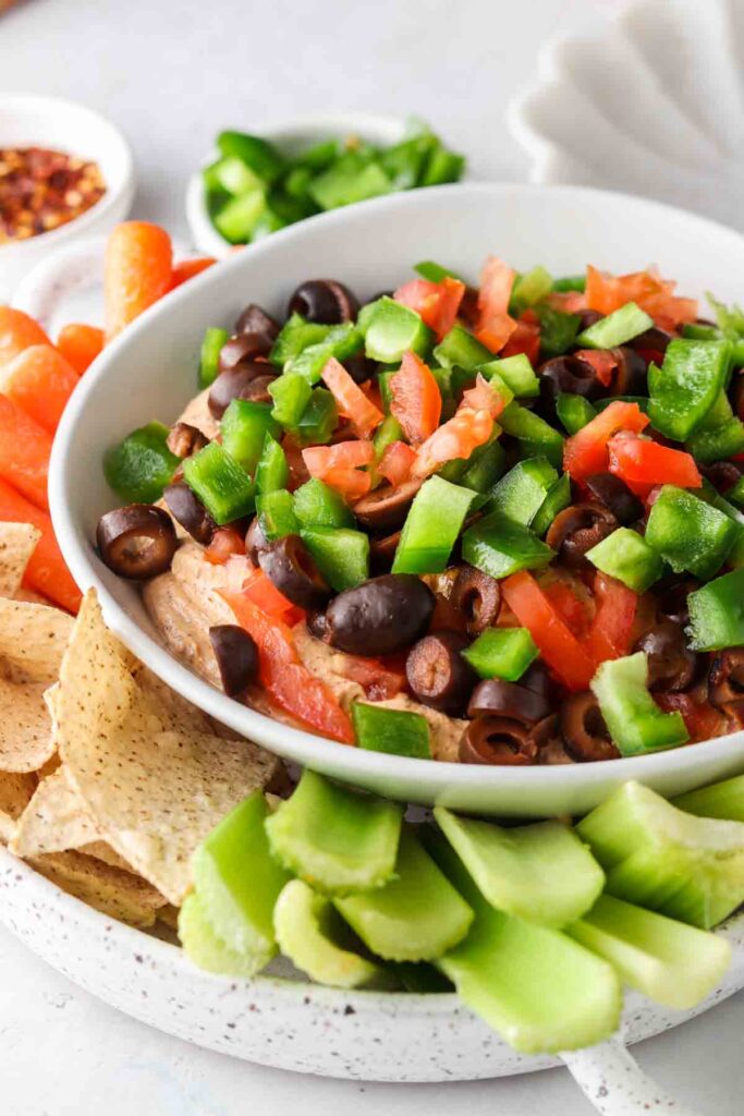 keto taco dip on a plate with celery