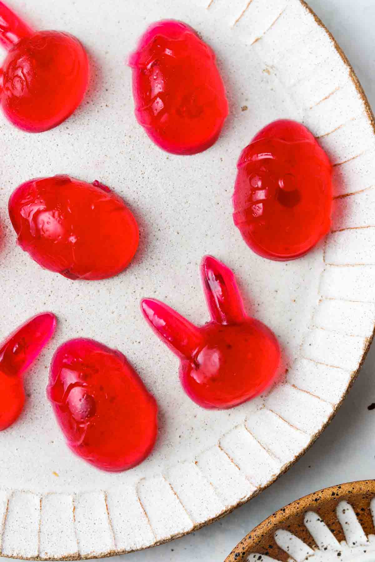 Pretty red jello eggs and bunnies on a plate.