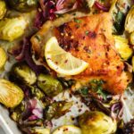 cooked chicken thighs on a sheet pan