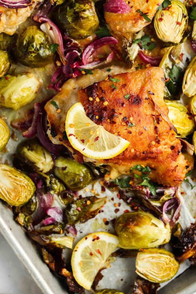 cooked chicken thighs on a sheet pan