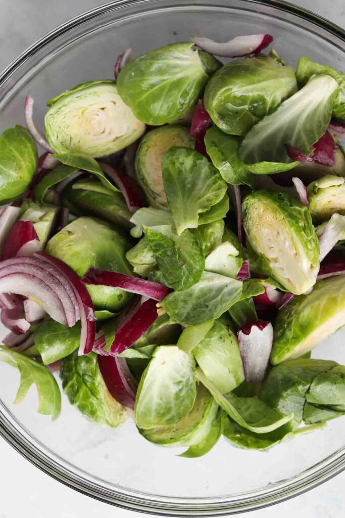 brussel sprouts and onions in a bowl