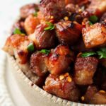 close up photo of pork belly in a bowl